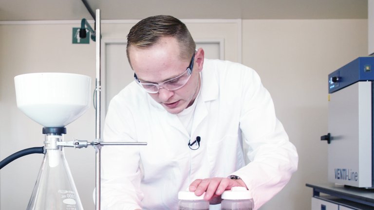 Man in white coat in laboratory